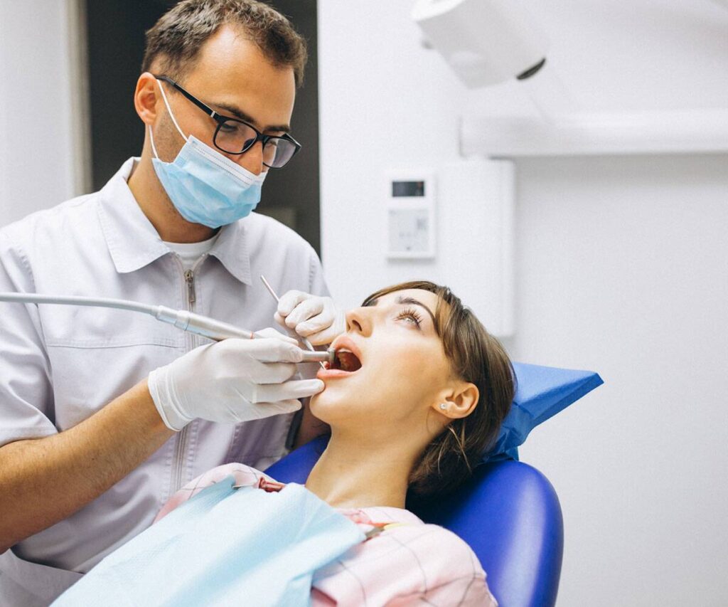 Dental professional providing restorative care